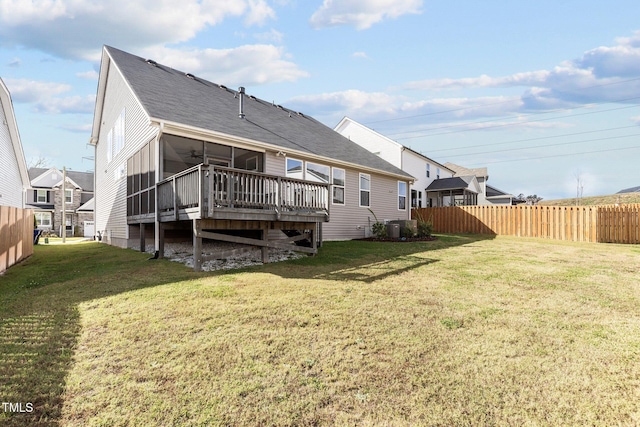 back of house with roof with shingles, a wooden deck, central AC, fence, and a yard