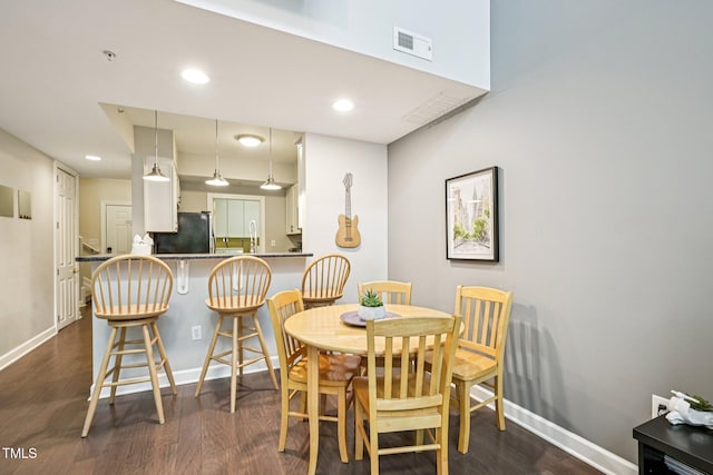 200 S Dawson St Unit 114, Raleigh, NC 27601 - dining room with dark wood-style floors and recessed lighting