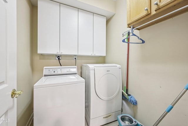 200 S Dawson St Unit 114, Raleigh, NC 27601 - washroom featuring washing machine and clothes dryer and cabinet space