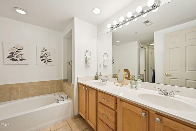 200 S Dawson St Unit 114, Raleigh, NC 27601 - bathroom with tile patterned flooring, double vanity, a bath, and recessed lighting