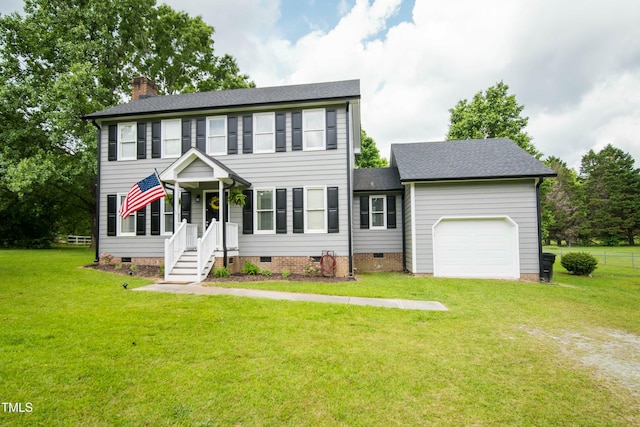 colonial inspired home with roof with shingles, an attached garage, a front lawn, crawl space, and a chimney