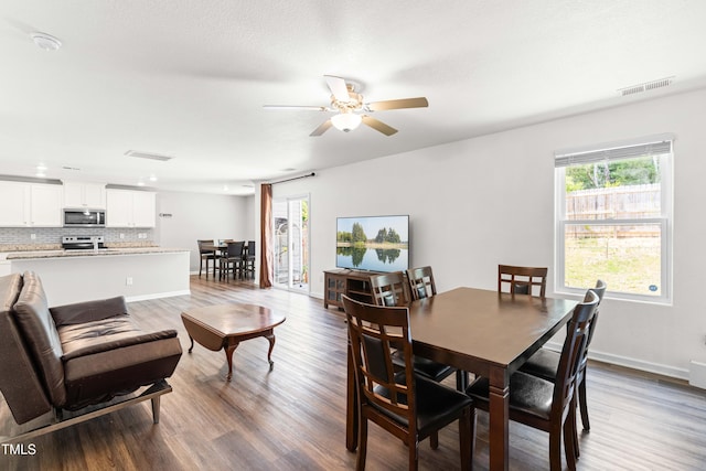 224 Brisk Dr, Zebulon, NC 27597 - dining room featuring a ceiling fan, wood finished floors, and baseboards