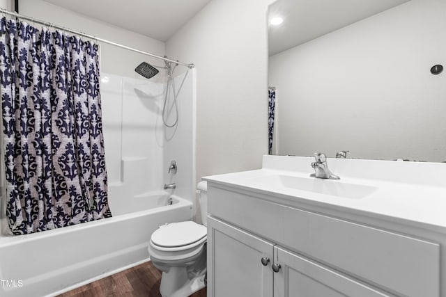 224 Brisk Dr, Zebulon, NC 27597 - bathroom featuring vanity, wood finished floors, toilet, and shower / bath combo