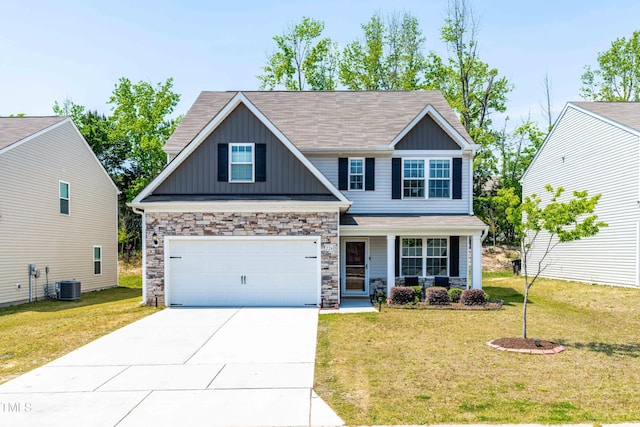 224 Brisk Dr, Zebulon, NC 27597 - craftsman house with board and batten siding, concrete driveway, a porch, a garage, and a front yard