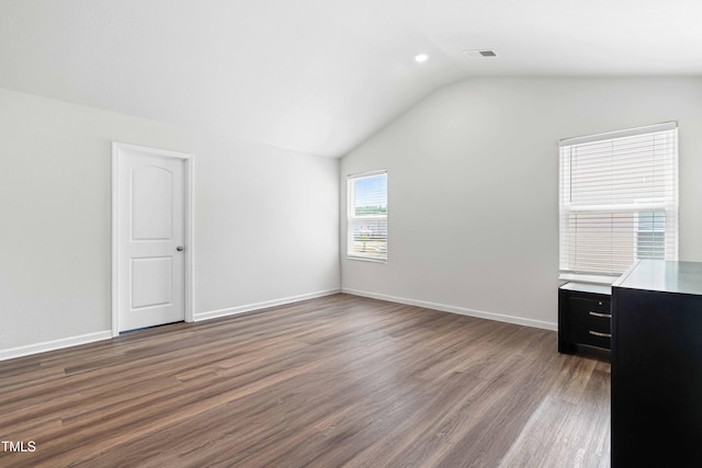 224 Brisk Dr, Zebulon, NC 27597 - unfurnished bedroom featuring lofted ceiling, wood finished floors, and baseboards