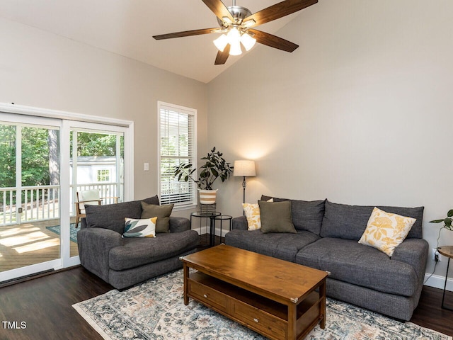 living room featuring wood finished floors, a ceiling fan, high vaulted ceiling, and baseboards