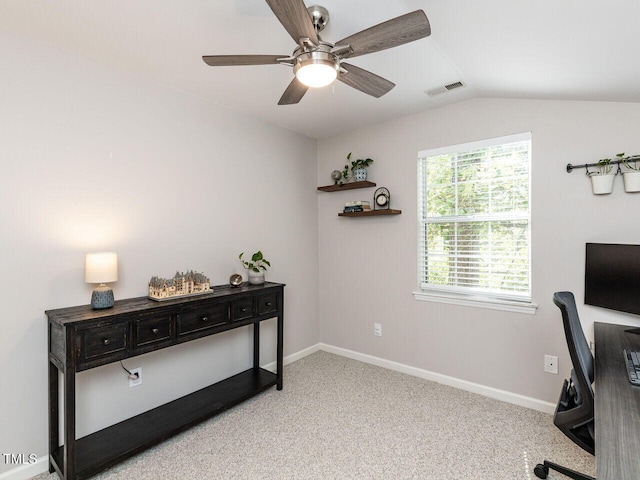 office space featuring ceiling fan, light carpet, lofted ceiling, and baseboards