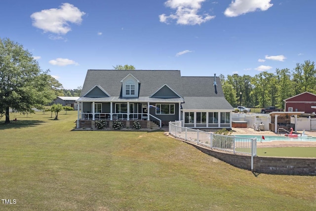back of house featuring a sunroom, roof with shingles, and a porch