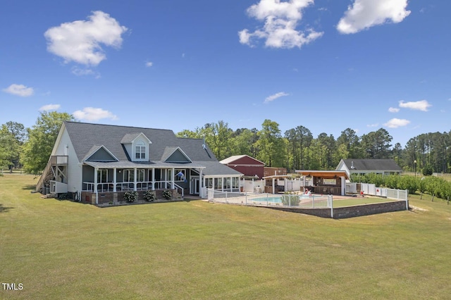 back of property featuring an outdoor pool and metal roof