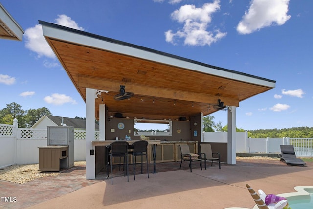 view of patio / terrace featuring a fenced backyard and ceiling fan
