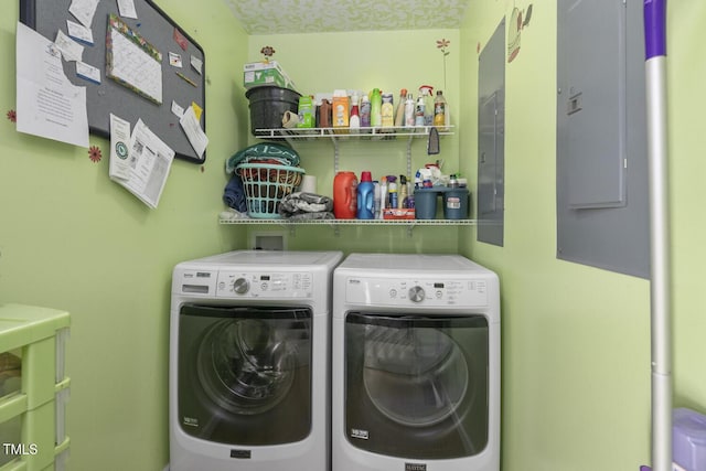 clothes washing area featuring washer and clothes dryer