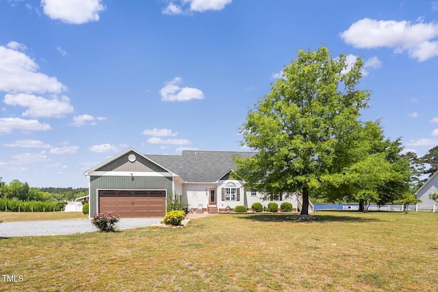 view of front of property featuring driveway and a garage