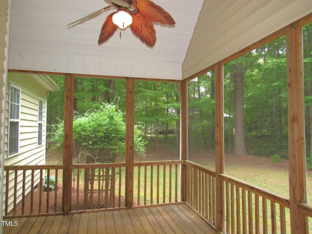 unfurnished sunroom with ceiling fan