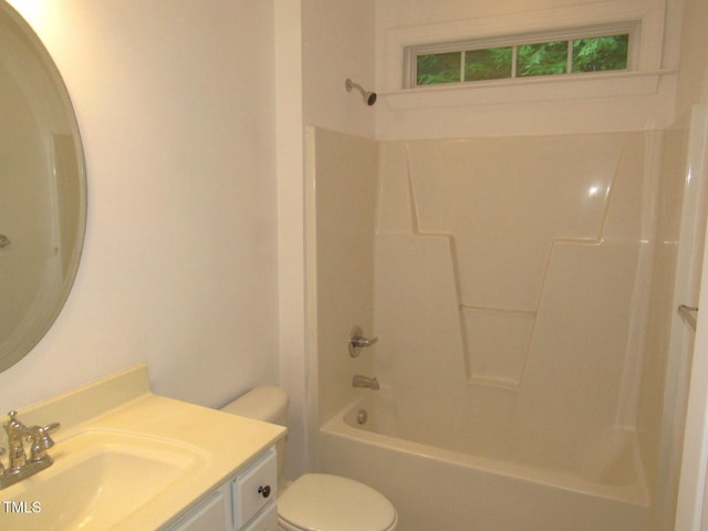 bathroom with toilet, tub / shower combination, and vanity