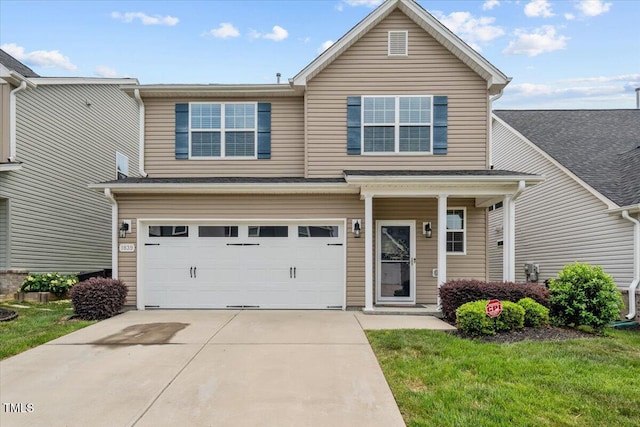 view of front of property featuring an attached garage, driveway, and a front yard