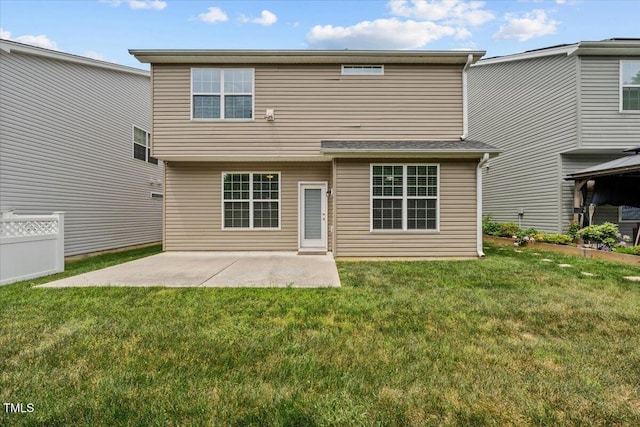 back of property featuring a patio area, fence, and a yard