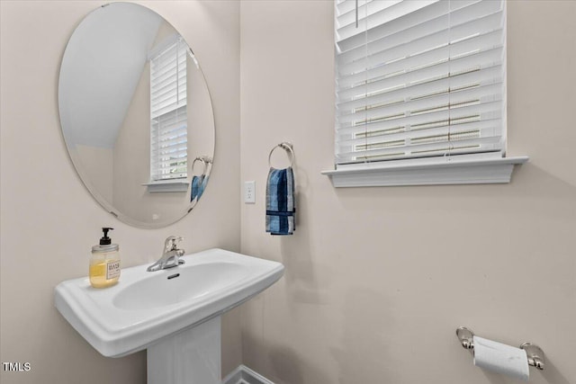 bathroom with a sink and a healthy amount of sunlight