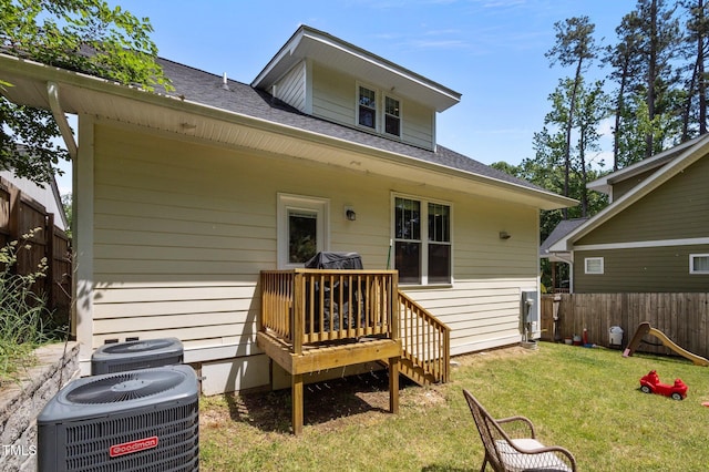 2003 Wa Wa Ave, Durham, NC 27707 - rear view of property with fence, central air condition unit, a shingled roof, and a lawn