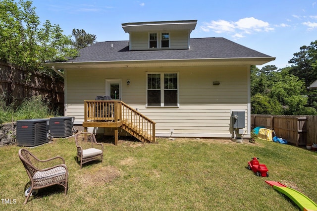 2003 Wa Wa Ave, Durham, NC 27707 - rear view of property with a lawn, a shingled roof, a fenced backyard, and cooling unit