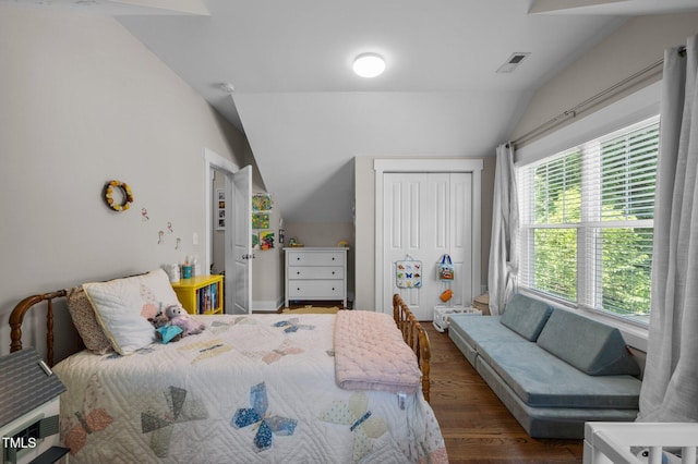 2003 Wa Wa Ave, Durham, NC 27707 - bedroom with wood finished floors, lofted ceiling, and visible vents