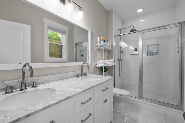 2003 Wa Wa Ave, Durham, NC 27707 - bathroom featuring double vanity, toilet, a sink, and a stall shower