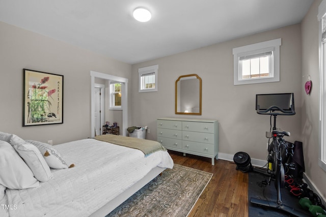 2003 Wa Wa Ave, Durham, NC 27707 - bedroom featuring baseboards and dark wood-style flooring