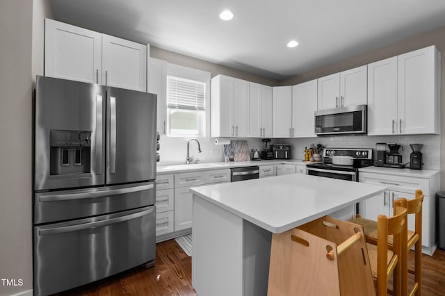 2003 Wa Wa Ave, Durham, NC 27707 - kitchen featuring a sink, appliances with stainless steel finishes, backsplash, and recessed lighting