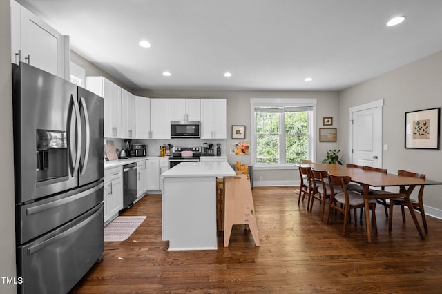 2003 Wa Wa Ave, Durham, NC 27707 - kitchen featuring white cabinets, dark wood-style flooring, appliances with stainless steel finishes, light countertops, and recessed lighting