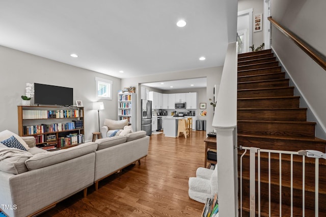 2003 Wa Wa Ave, Durham, NC 27707 - living room featuring stairs, recessed lighting, and wood finished floors