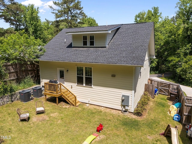 2003 Wa Wa Ave, Durham, NC 27707 - back of property featuring a fenced backyard, a yard, and cooling unit