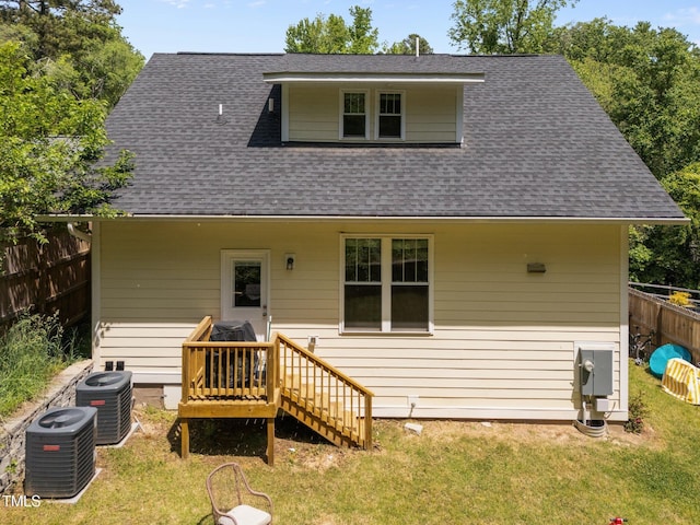2003 Wa Wa Ave, Durham, NC 27707 - back of property featuring a shingled roof, fence, and cooling unit