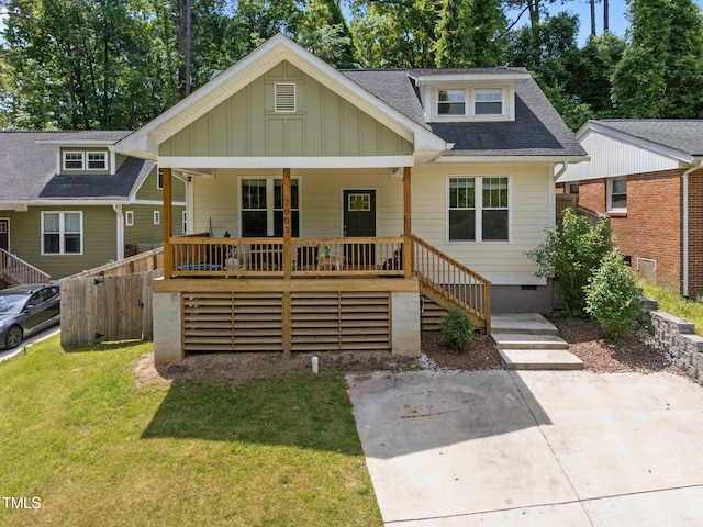2003 Wa Wa Ave, Durham, NC 27707 - view of front of house with stairs, a shingled roof, a front lawn, crawl space, and covered porch