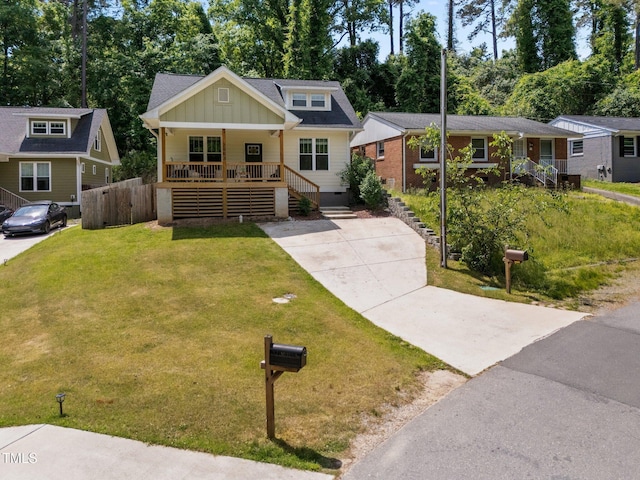 2003 Wa Wa Ave, Durham, NC 27707 - craftsman house with a front lawn, board and batten siding, crawl space, a porch, and driveway