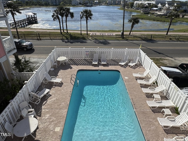 504 Carolina Beach Ave S Unit 2L, Carolina Beach, NC 28428 - community pool featuring a fenced backyard, a water view, and a patio