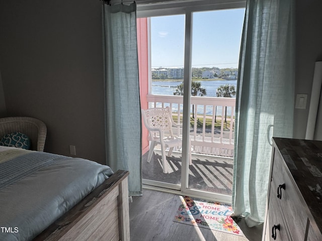 504 Carolina Beach Ave S Unit 2L, Carolina Beach, NC 28428 - bedroom with a water view and wood finished floors