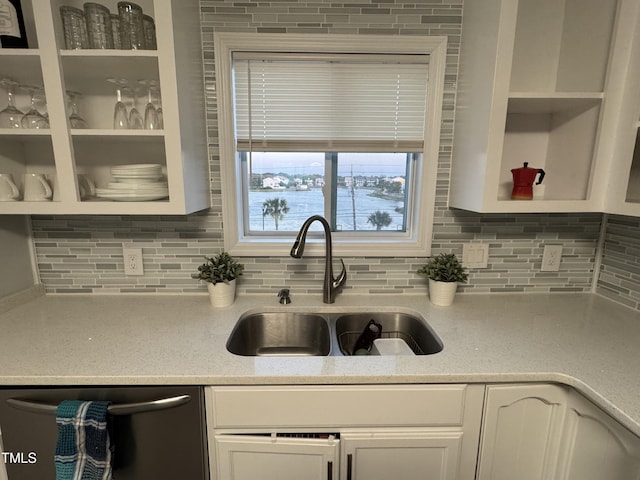 504 Carolina Beach Ave S Unit 2L, Carolina Beach, NC 28428 - kitchen with a sink, stainless steel dishwasher, tasteful backsplash, white cabinetry, and open shelves