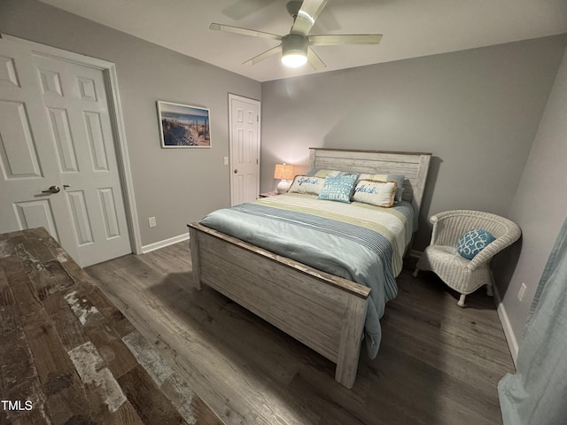 504 Carolina Beach Ave S Unit 2L, Carolina Beach, NC 28428 - bedroom with wood finished floors, baseboards, and ceiling fan