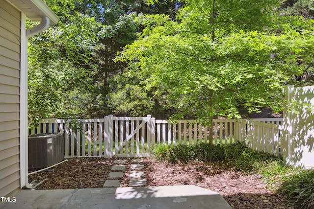 view of yard with fence and cooling unit