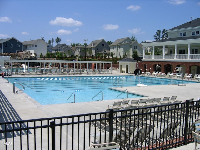 community pool featuring a residential view
