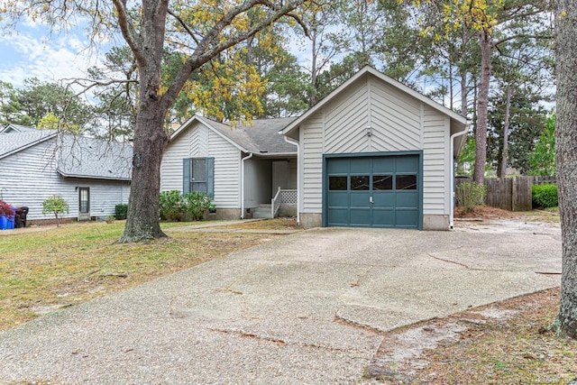 5516 Deep Hollow Ct, Fayetteville, NC 28311 - ranch-style house featuring fence, aphalt driveway, and a garage
