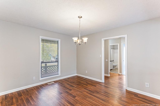 5516 Deep Hollow Ct, Fayetteville, NC 28311 - unfurnished room with visible vents, a notable chandelier, dark wood-style flooring, and baseboards