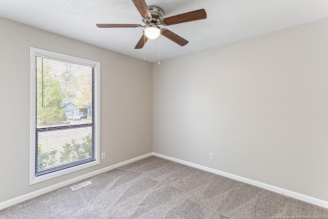 5516 Deep Hollow Ct, Fayetteville, NC 28311 - unfurnished room featuring a ceiling fan, carpet flooring, a wealth of natural light, and visible vents