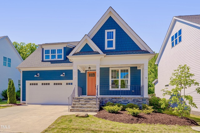 127 Post Oak Rd, Chapel Hill, NC 27516 - craftsman house featuring covered porch, concrete driveway, a garage, and a shingled roof
