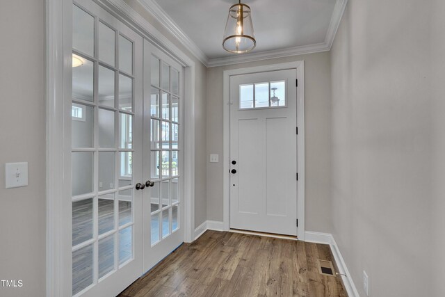 127 Post Oak Rd, Chapel Hill, NC 27516 - foyer entrance featuring french doors, crown molding, baseboards, and wood finished floors