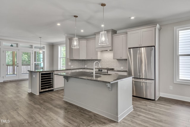 127 Post Oak Rd, Chapel Hill, NC 27516 - kitchen with freestanding refrigerator, wine cooler, crown molding, custom exhaust hood, and backsplash