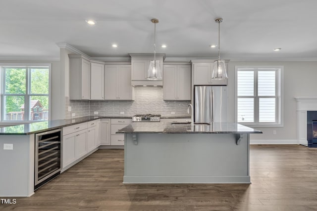 127 Post Oak Rd, Chapel Hill, NC 27516 - kitchen featuring stainless steel appliances, a sink, wine cooler, ornamental molding, and custom exhaust hood