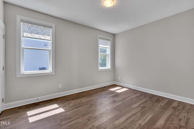 127 Post Oak Rd, Chapel Hill, NC 27516 - spare room featuring dark wood-type flooring and baseboards