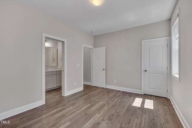 127 Post Oak Rd, Chapel Hill, NC 27516 - unfurnished bedroom featuring wood finished floors, baseboards, and ensuite bath