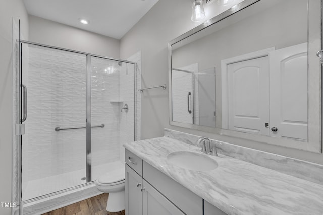 127 Post Oak Rd, Chapel Hill, NC 27516 - full bath with toilet, wood finished floors, a shower stall, vanity, and recessed lighting