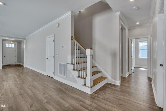127 Post Oak Rd, Chapel Hill, NC 27516 - foyer with ornamental molding, wood finished floors, baseboards, stairs, and recessed lighting